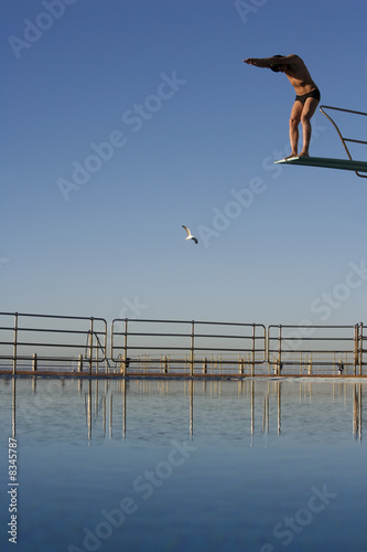 Photo: A man diving into a pool A man diving into a pool