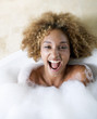 Portrait of a young woman in a bath