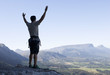 A climber celebrating reaching the top