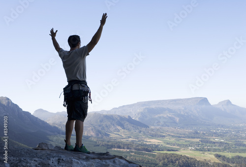 Photo: A climber celebrating reaching the top A climber celebrating reaching the top