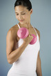 A young woman lifting weights