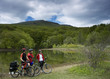 Couple riding bikes in a mountain