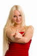 Long-haired blonde dressed up in red alluring you with her