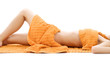 torso of relaxed lady with orange towels