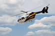 Helicopter flying through air