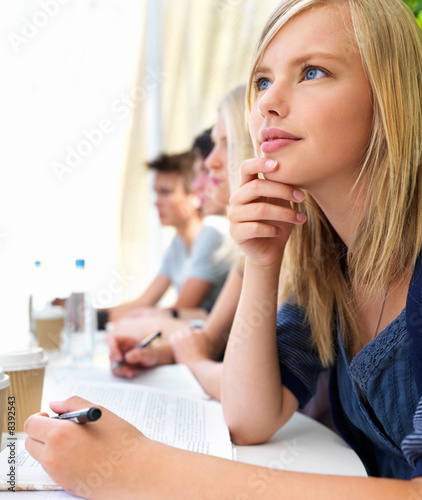 Boys and girls sitting together with notes