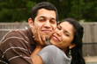 Happy hispanic couple hugging