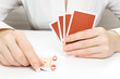 Woman putting card on the table