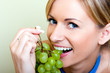 Beautiful woman with green grape