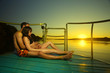 Photo: Couple in sunset hug on boat Couple in sunset hug on boat
