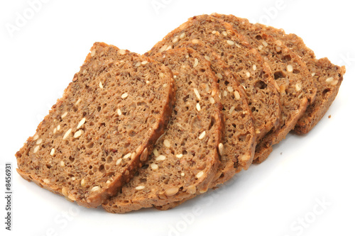 Photo: wholegrain bread slices on white background wholegrain bread slices on white background