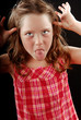 young girl making face