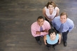 Four businesspeople standing and smiling