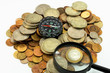 Compass, coins and magnifying glass Compass, coins and magnifying glass