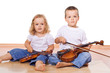 Little boy and girl with violins