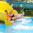 father with the son on waterslide