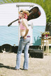Woman in front of Travel Trailer