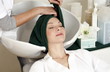 Young woman  having her hair  washed at a salon