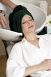 Young woman  having her hair  washed at a salon