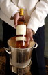 Waiter displaying wine bottle