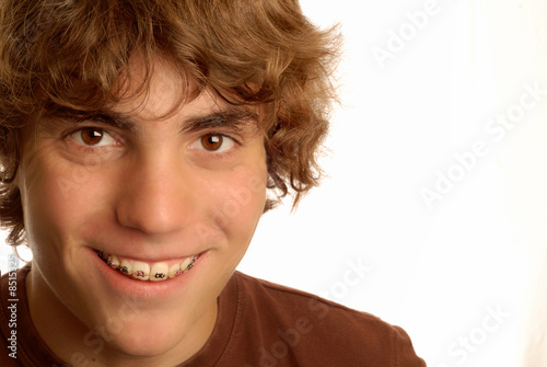 Photo: fourteen year old boy wearing braces with big smile fourteen year old boy wearing braces with big smile