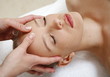 Woman having facial massage