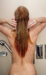 Woman taking a shower at the gym