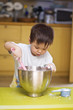 Child with mixing bowl and spatula Child with mixing bowl and spatula