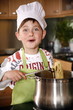 Boy cooking spaghetti
