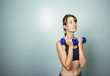 Woman Exercising with Dumbells