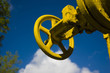 Yellow stopcock on sky background Yellow stopcock on sky background