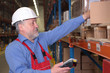 Photo: Older worker with scanner maintaining stocks Older worker with scanner maintaining stocks