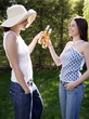 Two women drinking beer