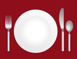 Silverware with a plate on red background