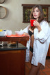 Sexy brunette eating breakfast