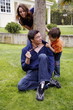 Parents and child playing in the yard