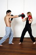 Straight right-hand punch of Active Tae Bo and inside block