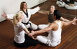 Participants in a fitness class practicing breathing exercises