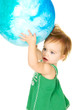 Cute toddler holding a big Ggobe over her head Cute toddler holding a big Ggobe over her head