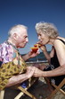 Photo: Senior couple with cocktail on beach Senior couple with cocktail on beach
