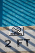 A "no diving" sign on a pool deck