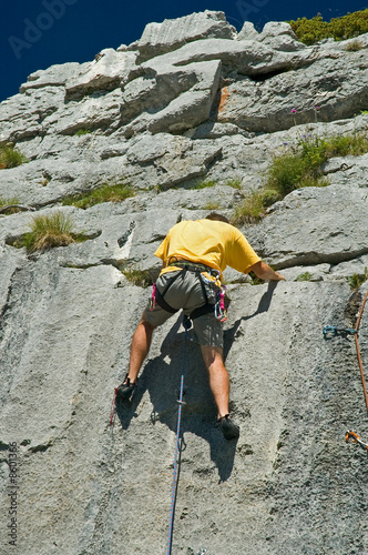 Photo: Rock climber climbing limestone, Switerland Rock climber climbing limestone, Switerland