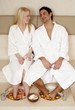 A young couple enjoying a foot bath with rose petals