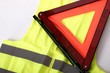 warning triangle and yellow waistcoat