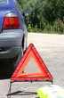 warning triangle and yellow waistcoat