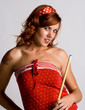Redhead girl holding a pool cue
