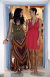 Two young women in art gallery doorway