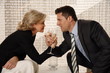 Man and woman sitting in hotel lobby