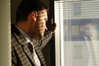 Lonely business man and his reflection