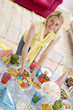 Woman at party setting out food and smiling
